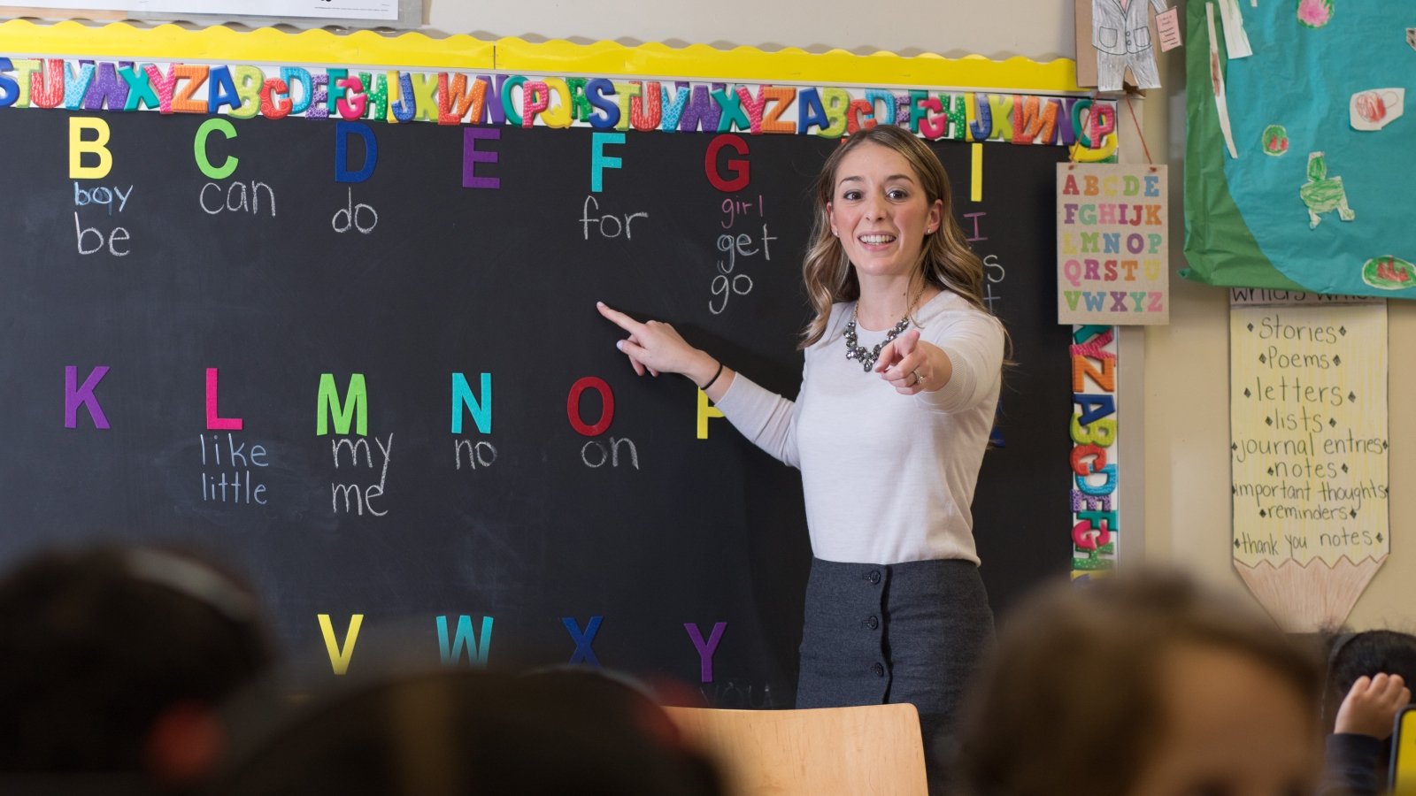 Teacher in classroom with students