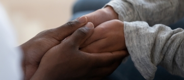 Holding hands during counseling.