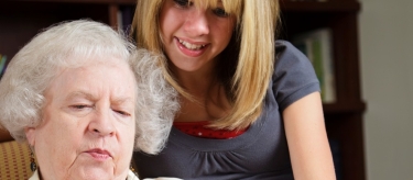 Gerontology student working with a senior