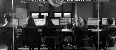 Students learning in Mercy trading room