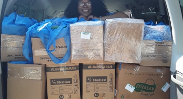 Boxes filled with backpacks 