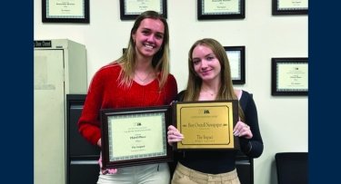 Photo of students and award