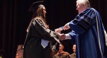 President Hall and graduate