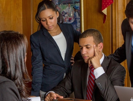 A group of Management students collaborating on a project.