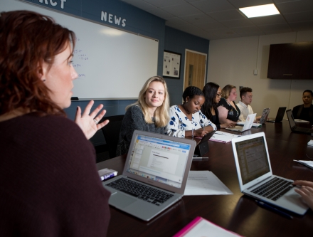 Students with computers in liberal arts class