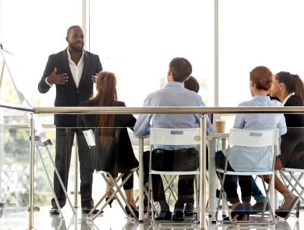 An Organizational Management graduate leading a brain-storming session.