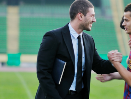 A sport Management graduate greeting one of his clients.