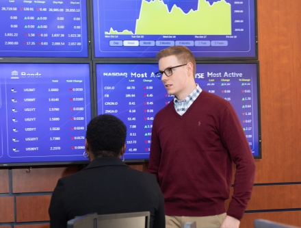 Students learning in Mercy trading room