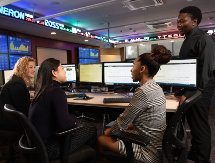 Students learning in Mercy trading room