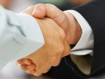 Handshake between Human Resource Manager and job candidate.