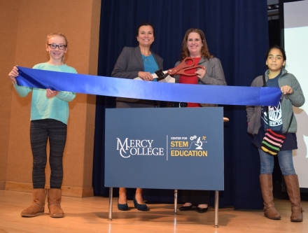 Women cutting a ribbon