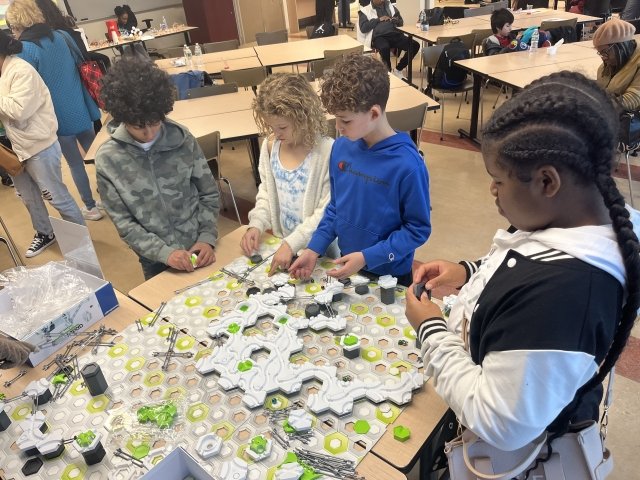 Middle school students engage in hands-on STEM activities at Mercy University's Bronx campus at the Spring Open House for the Verizon Innovative Learning STEM Achievers Program