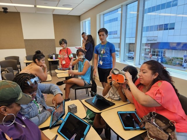 Verizon Innovative Learning STEM Achievers summer program participants show parents what they learned during their last day at Mercy's Bronx Campus