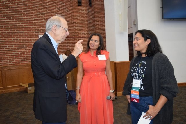 Dr. Arthur Eisenkraft speaking to Dr. Amanda Gunning and Anny Vanegas, a Wipro Reimagined Fellow 